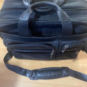 TUMI men’s black nylon briefcase gently used condition with lots of compartments